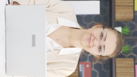 Vertical-video-of-Business-woman-winking-at-camera.